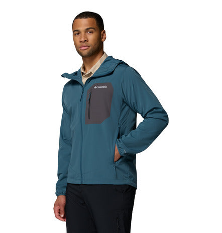 Man wearing a teal jacket with Columbia logo on a white background