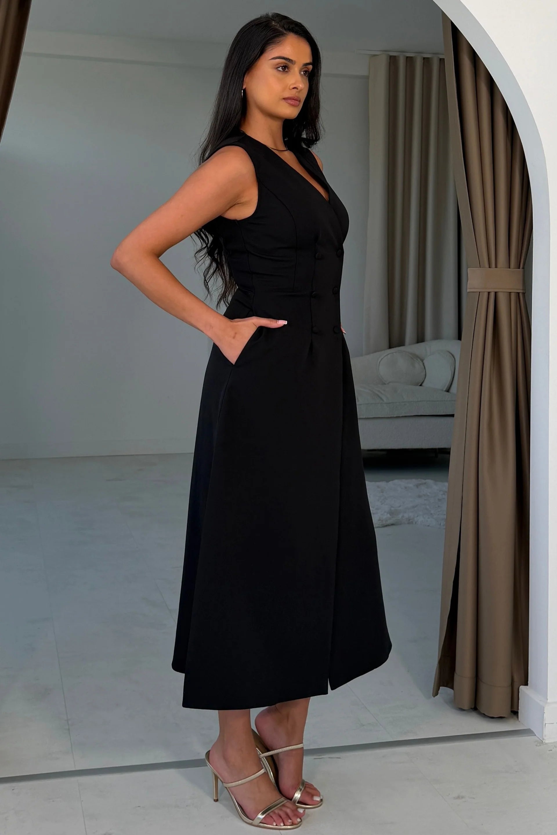 Girl In Mind Hazel tailored sleeveless midi dress in black, side model view