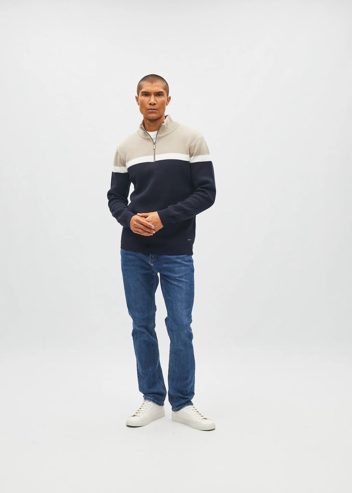 Diesel Tully Half Zip Sandshore sweater in sand, front view worn by model with white stripe and navy block.