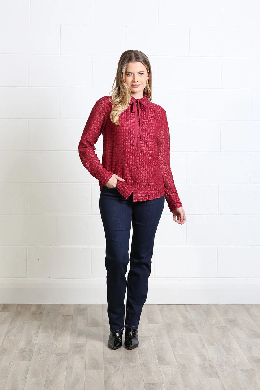 Rant & Rave Vivian Shirt in burgundy worn by a model, front view with pussybow neck tie and long sleeves