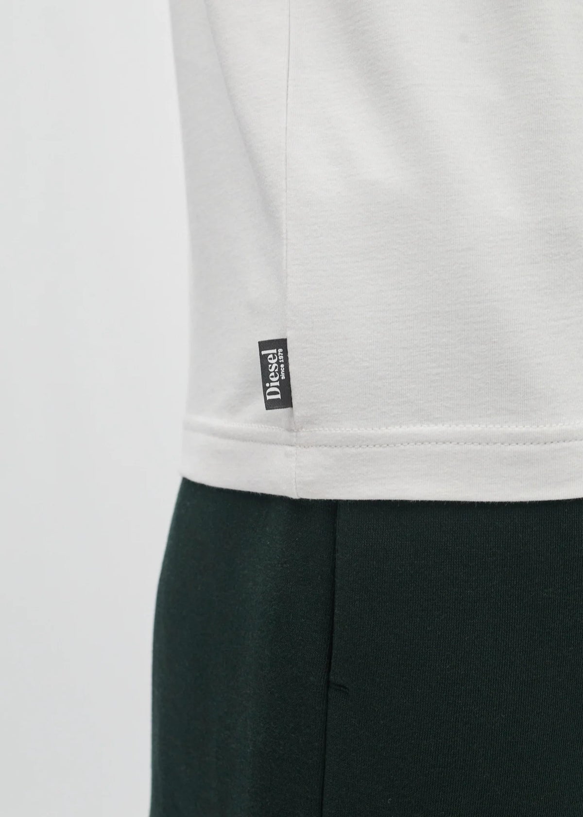 Diesel Walter Tee Wimbedon in white showing the hem and woven Diesel logo tag