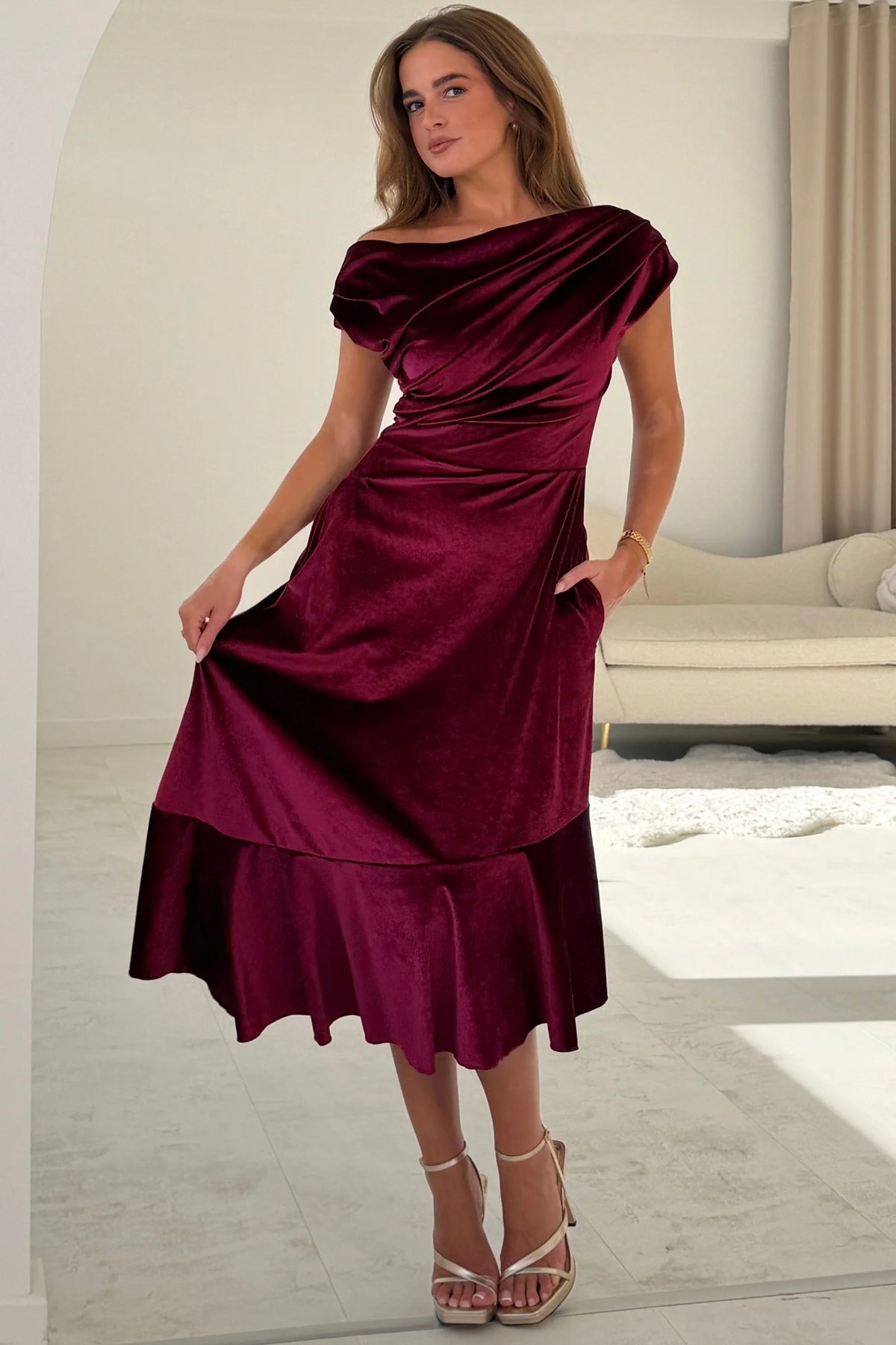 Girl In Mind Felicity asymmetric frill midi dress in berry velvet, angled model view showing off - shoulder frill neckline