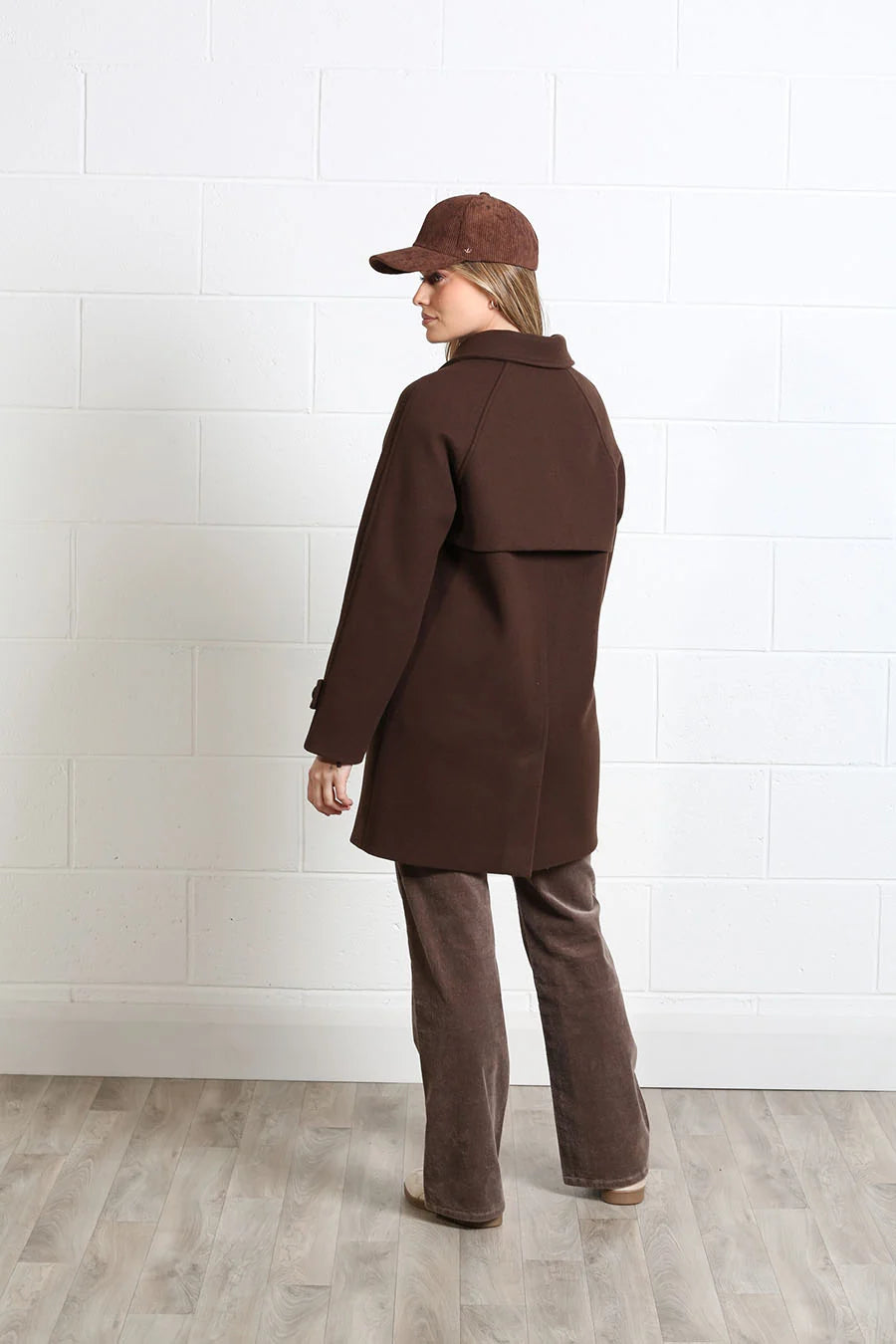 Rant & Rave Georgia Coat in chocolate brown worn by model, back view showing storm flap and raglan sleeves