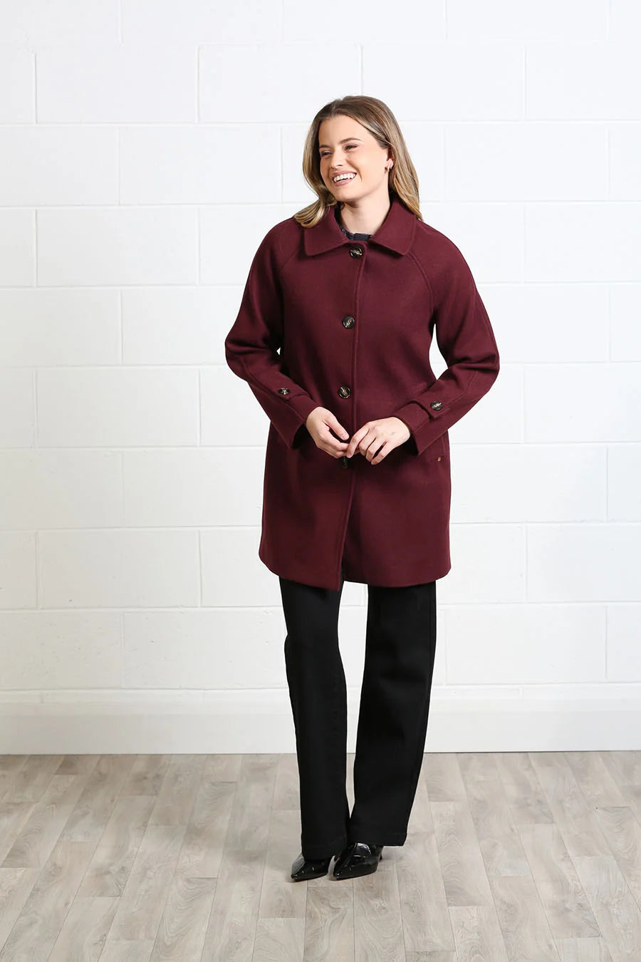 Rant & Rave Georgia Coat in deep port worn by model, front view with collar and button fastening