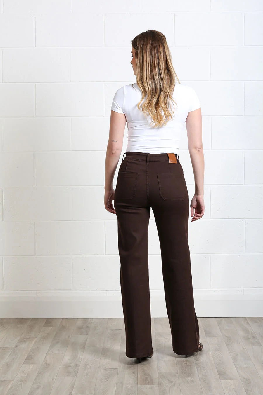 Rant & Rave Harriet Pintuck Wide Leg Jean in chocolate, back view worn by model showing pockets and leather patch