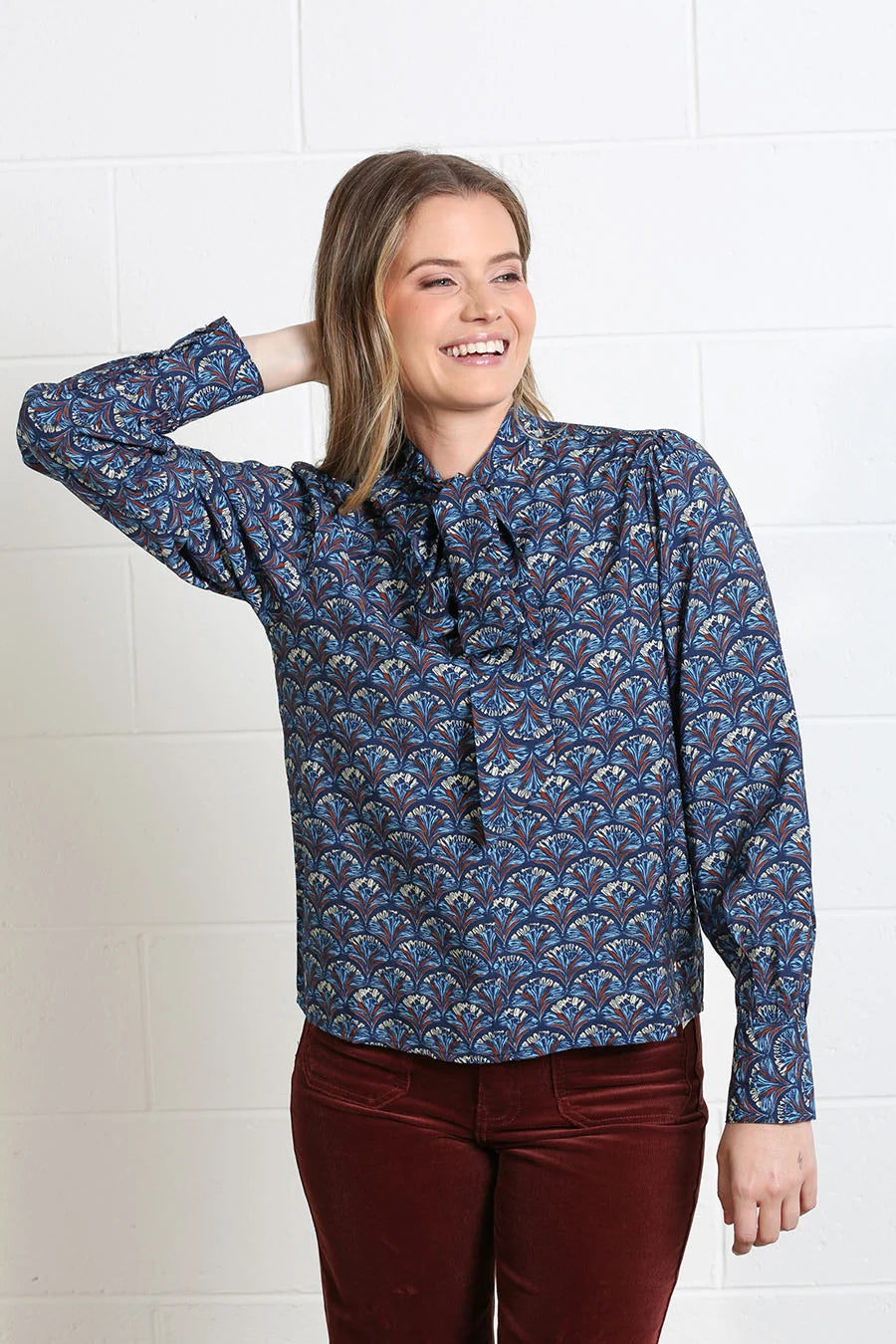 Rant & Rave Isabella Blouse in navy reef print, front model view with tie neck detail