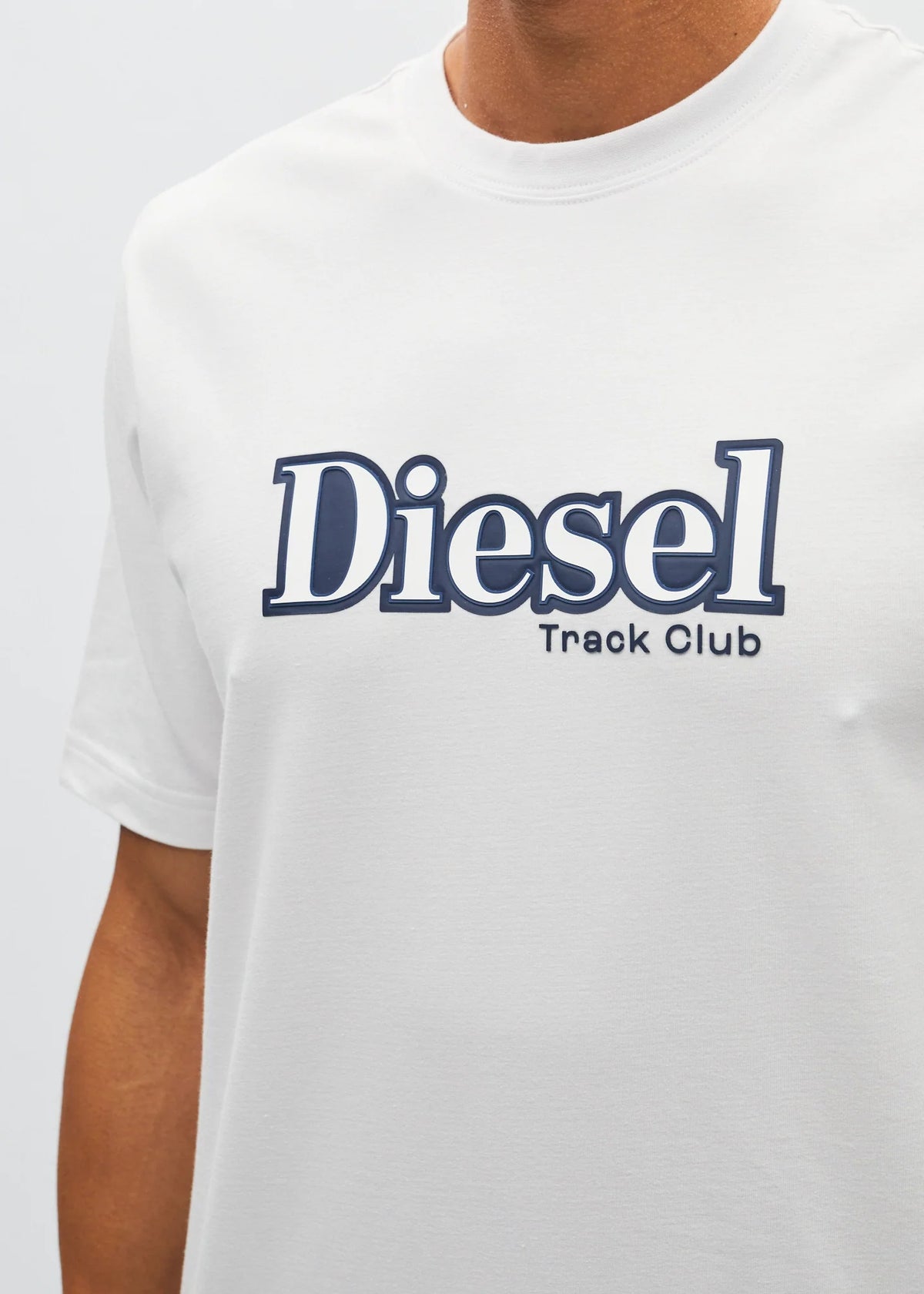 Close - up of the Diesel Track Club graphic on the white Walter Tee Wimbedon