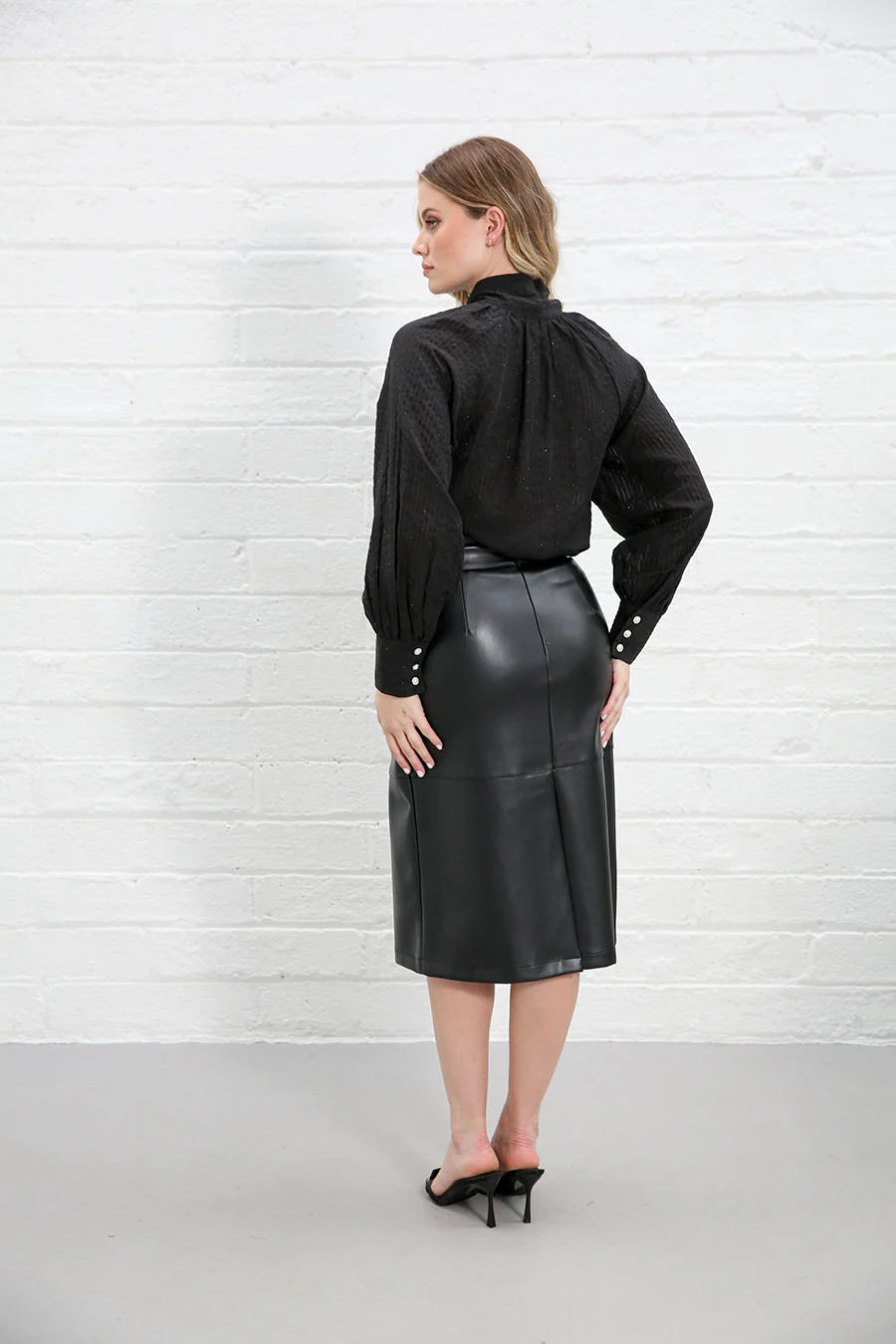 Rant & Rave Natalia Top Black worn by model, back view showing gathered yoke and button cuffs