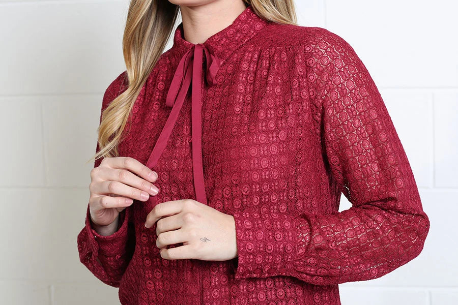 Rant & Rave Vivian Shirt in burgundy, detail view of the pussybow neck tie and lace texture
