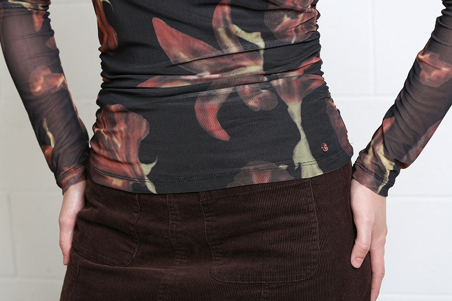 Rant & Rave Alanna Top in black, close detail of ruched waist and floral mesh fabric