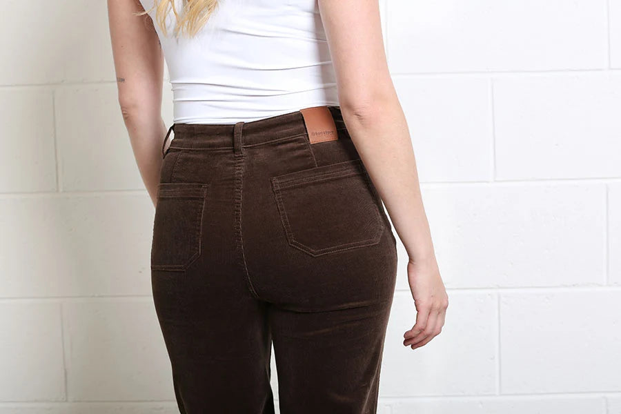 Close - up detail of the back pockets and waistband on the Rant & Rave Bridget Cord Wide Leg mocha trousers.