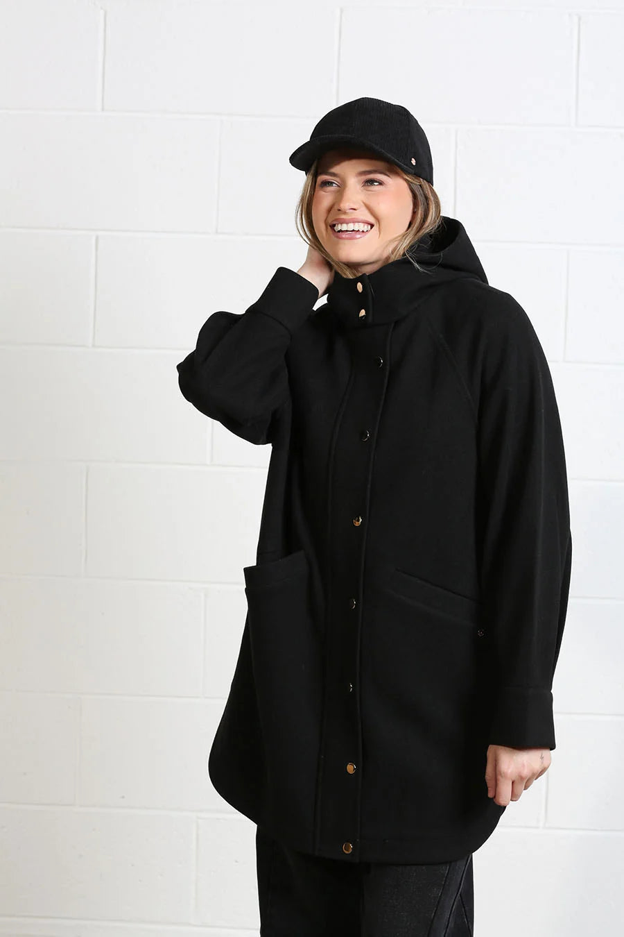 Rant & Rave Joanna Coat in black, front model view styled with cap