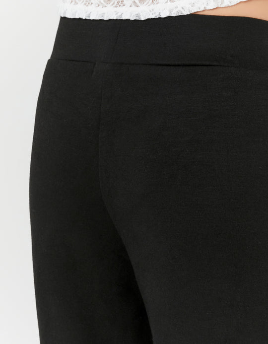 Detail view of the Tally Weijl black flared trousers waistband and side seam