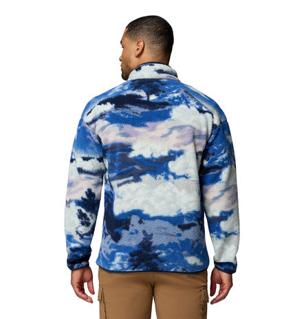 Person wearing a blue and white patterned jacket on a white background