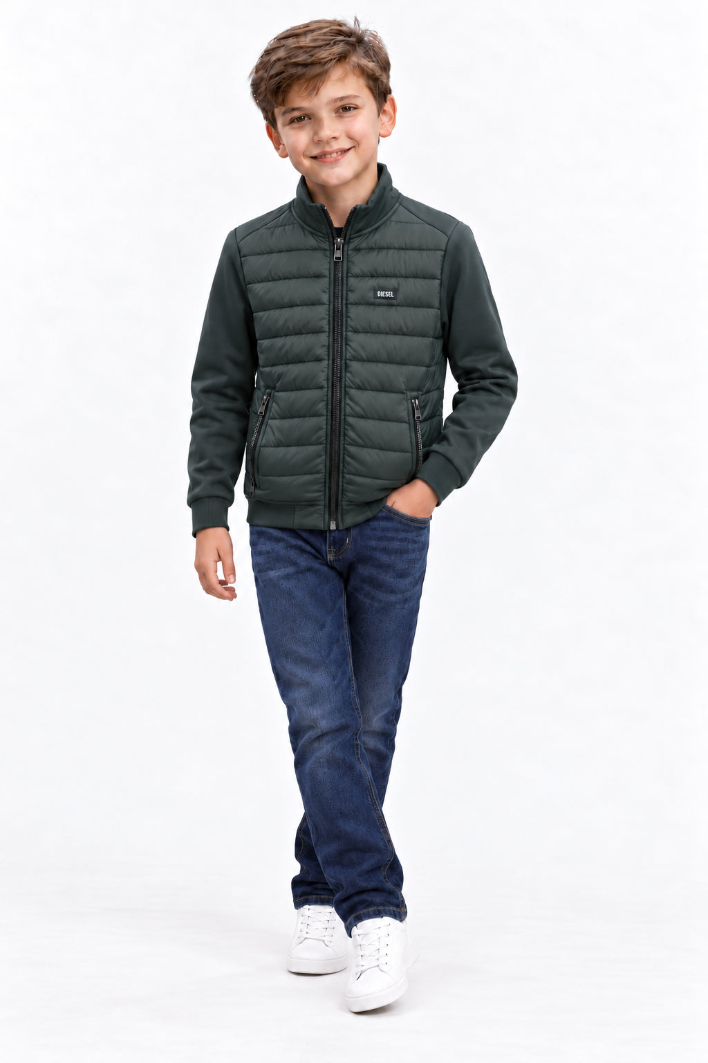 Boy wearing the Diesel Jared olive hybrid jacket with quilted front and zipped pockets.