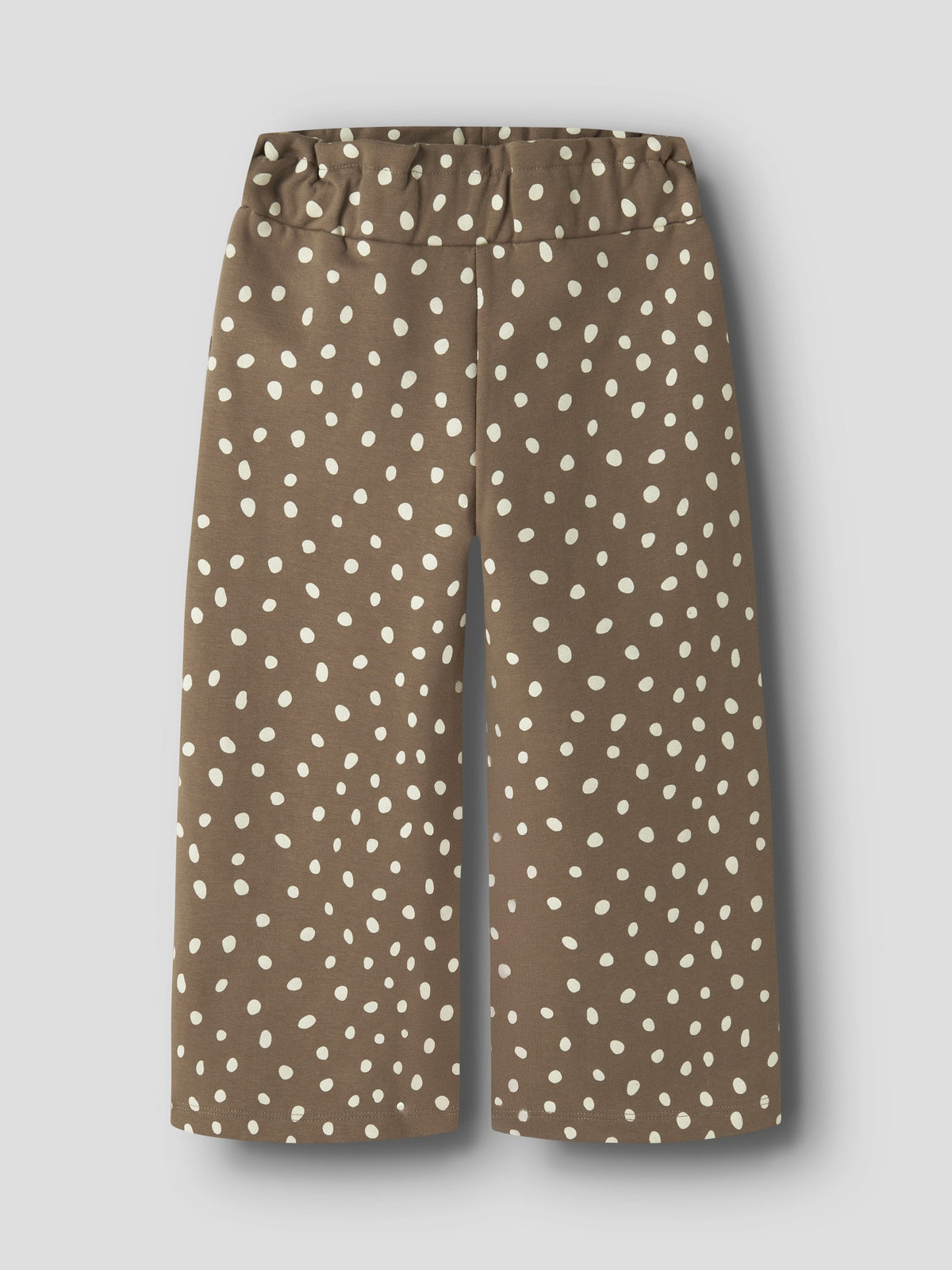 Front view of NAME IT Rammie dot-print sweatpants in Coca Mocha against a grey background