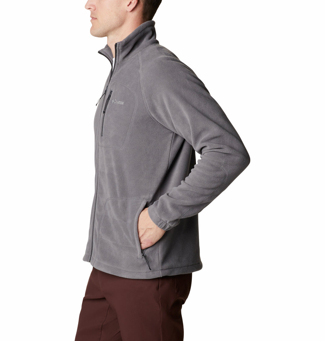 Person wearing a gray fleece jacket on a white background