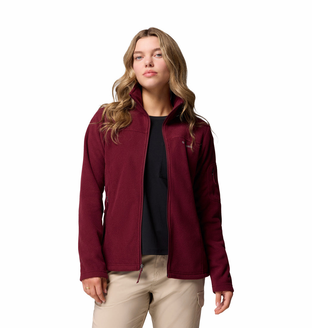 Woman wearing a maroon fleece jacket on a white background