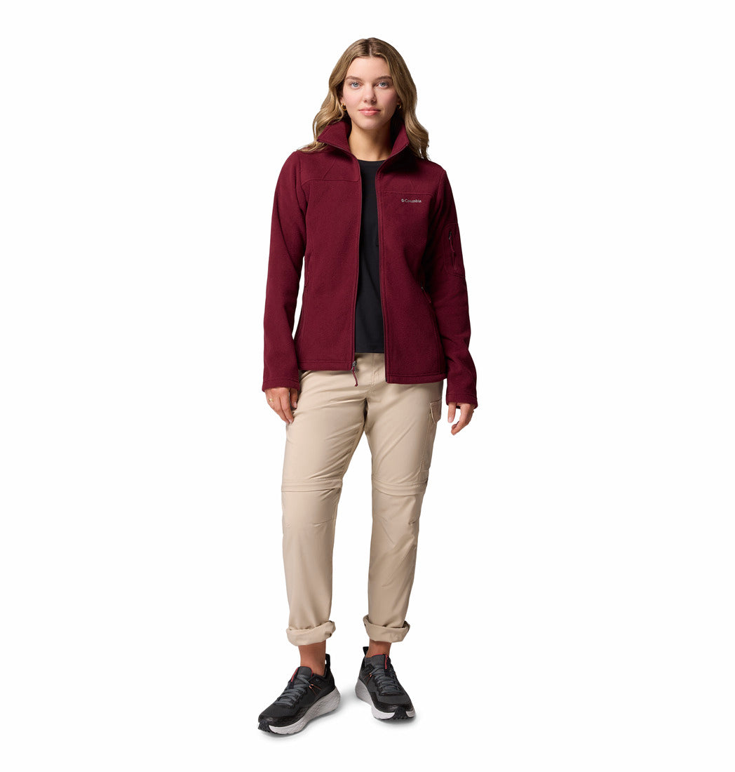 Woman wearing a burgundy fleece jacket with a hood on a white background