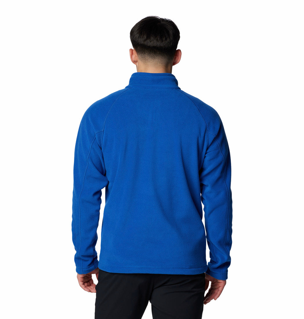 Person wearing a blue fleece jacket on a white background