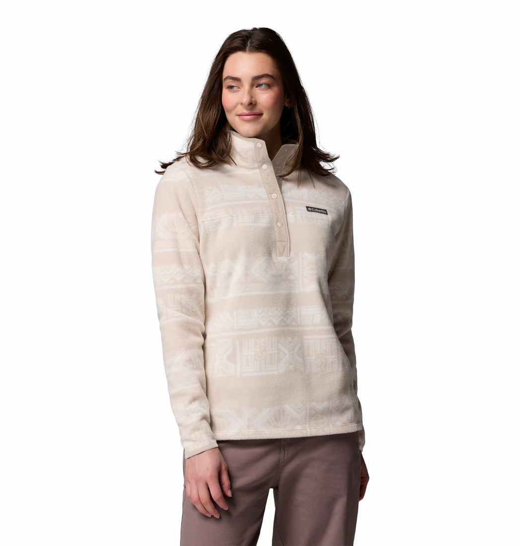 Woman wearing a beige fleece jacket on a white background