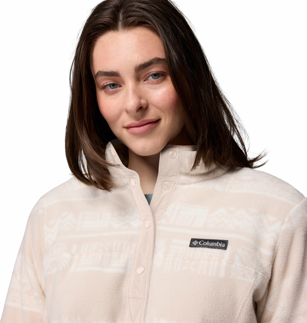 Woman wearing a beige Columbia jacket on a white background