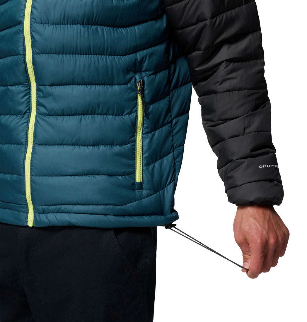 Close-up of a person wearing a teal and black puffer jacket with a visible brand logo.