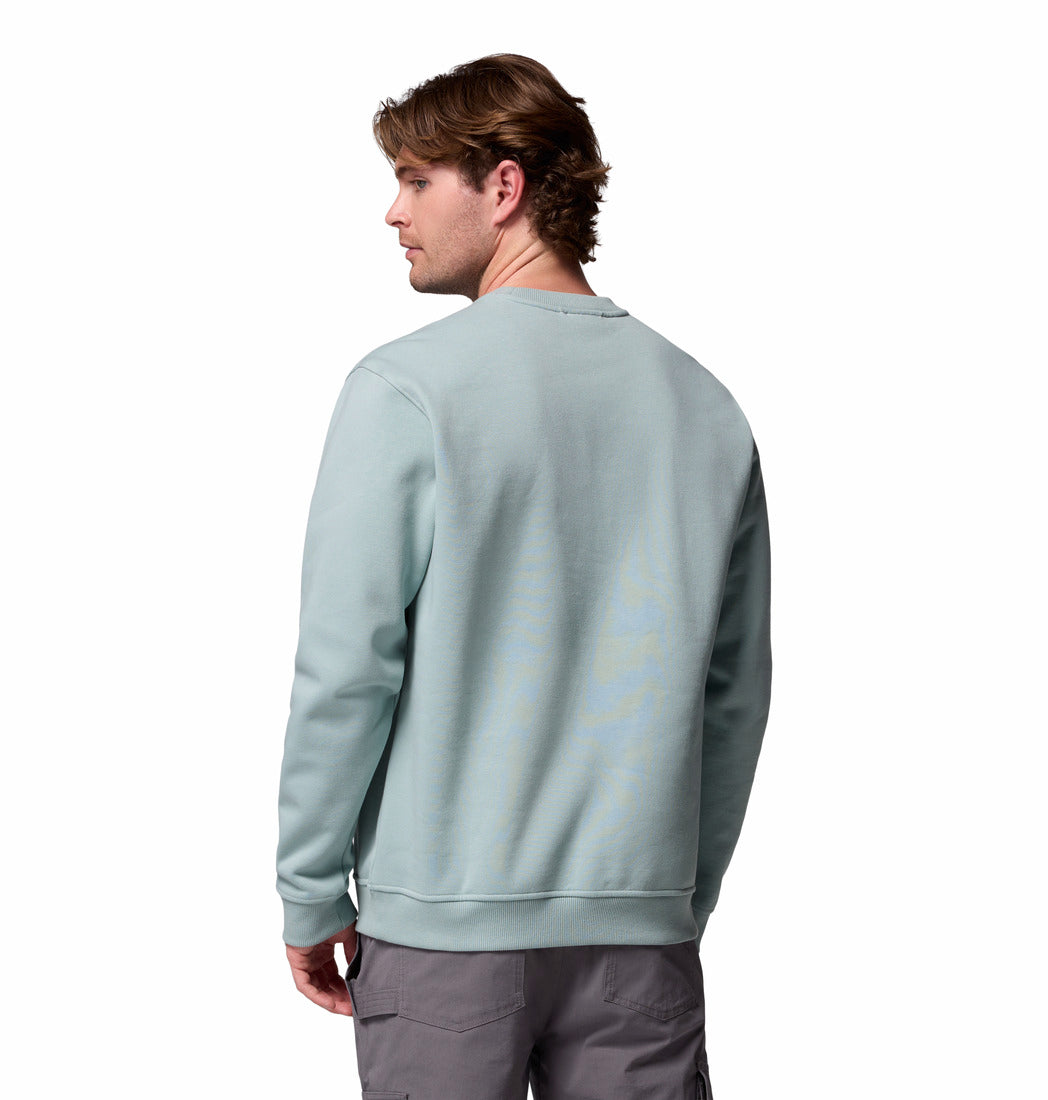 Person wearing a light blue sweatshirt on a white background