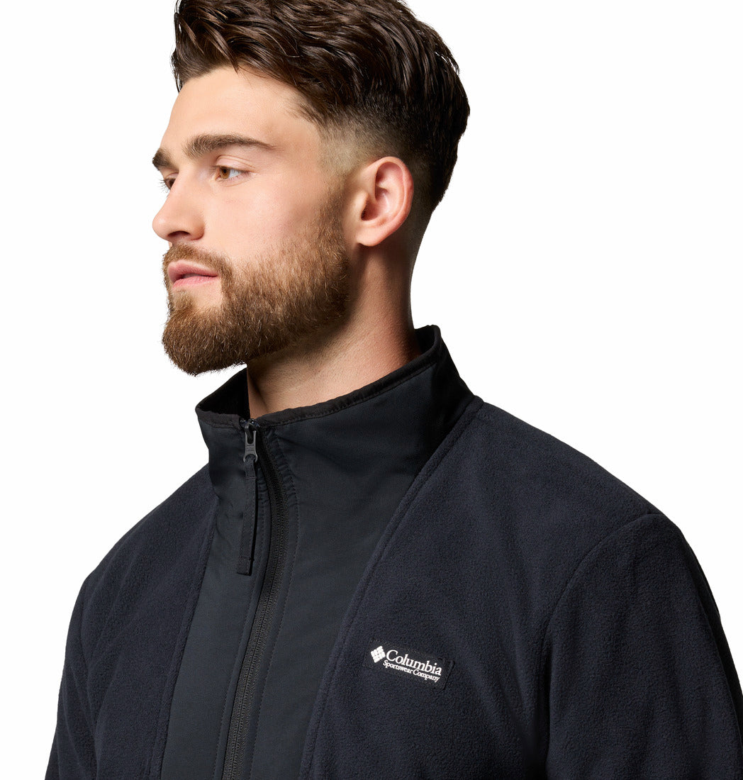 Man wearing a black Columbia jacket on a white background