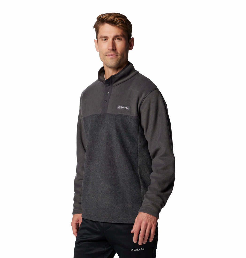 Man wearing a gray pullover with Columbia logo on a white background