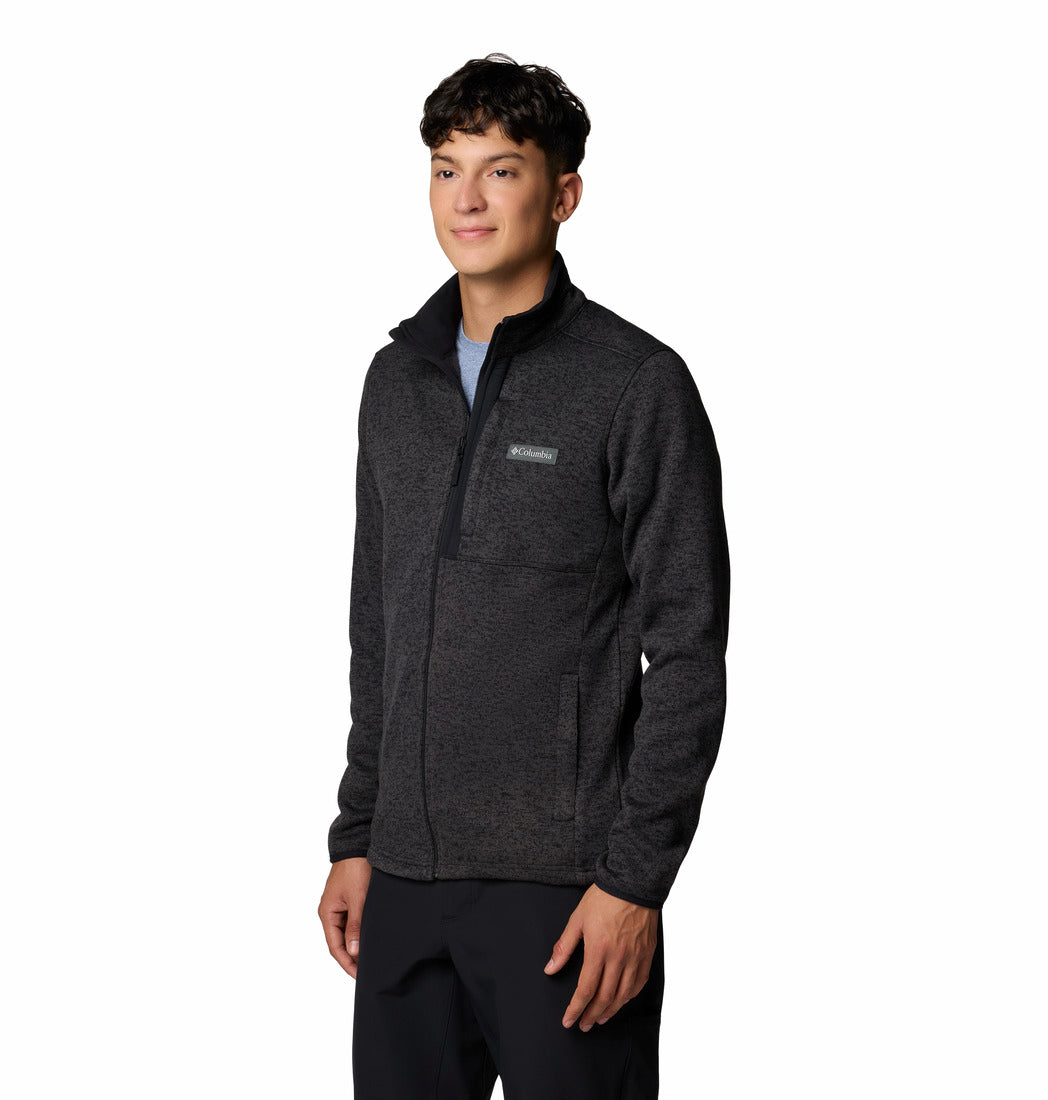 Person wearing a dark gray fleece jacket on a white background