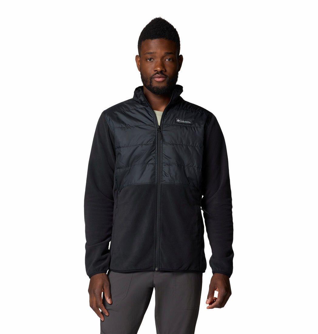 Man wearing a black jacket with a brand logo on a white background