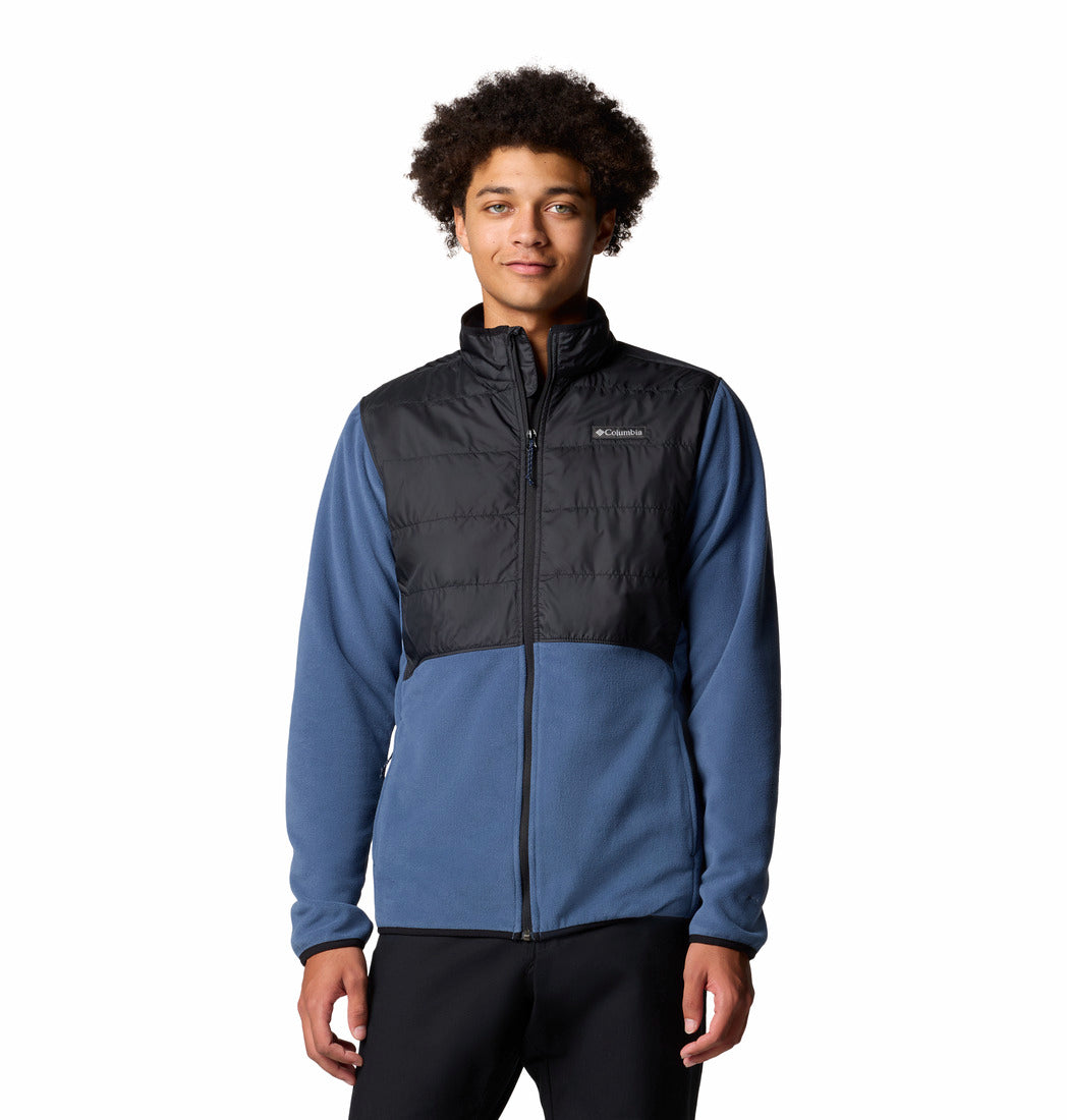 Person wearing a two-tone jacket with black and blue colors on a white background
