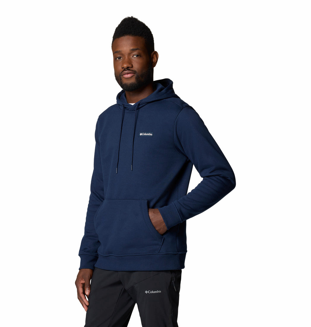 Man wearing a navy blue hoodie with Columbia logo on a white background