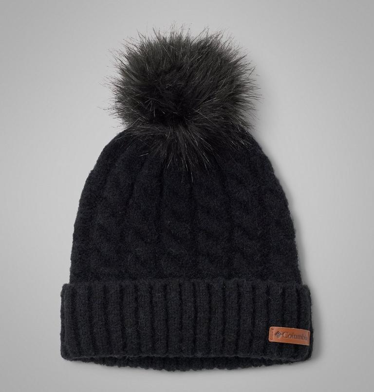 Black knit beanie with pom-pom on a gray background