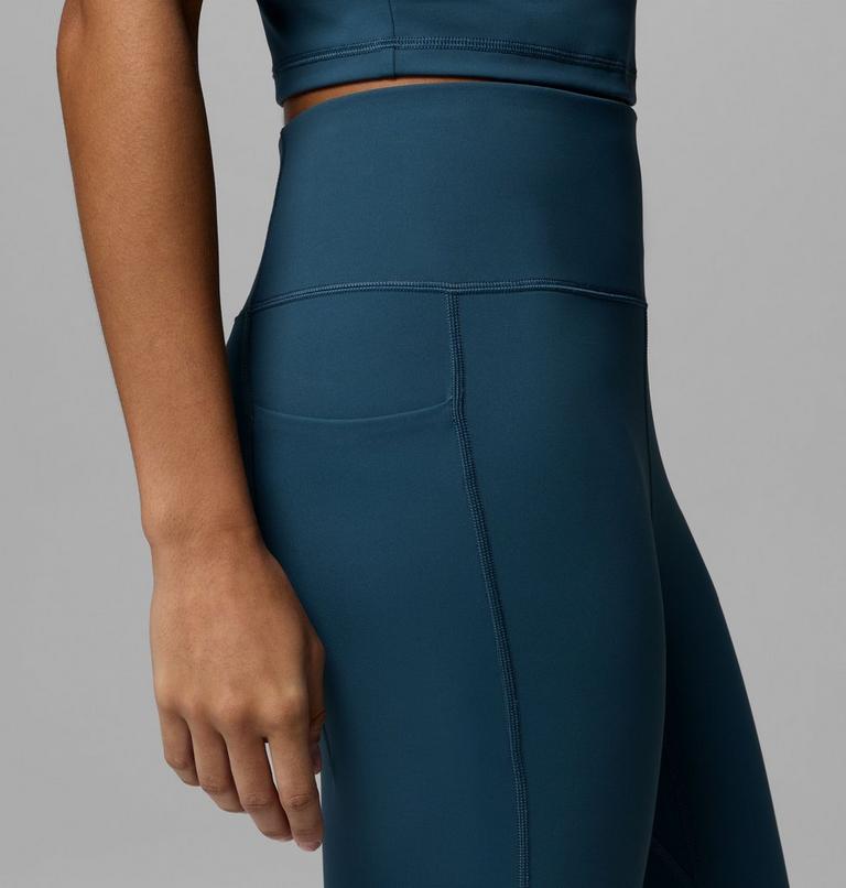Teal athletic outfit with a focus on leggings against a gray background