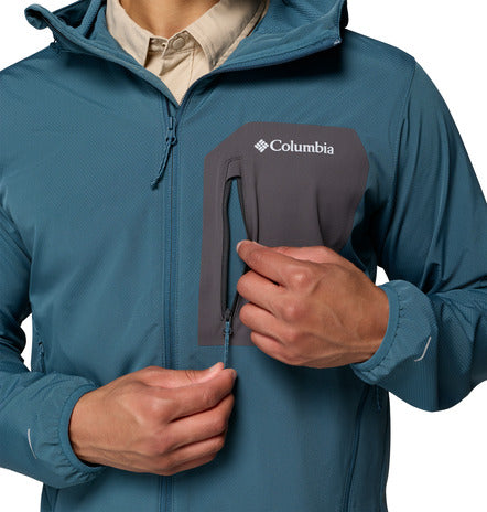 Person wearing a blue Columbia jacket with a close-up of the brand logo.