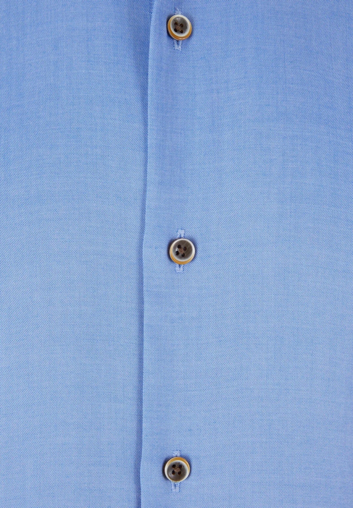 Close-up of 6th Sense Ocean Lyocell shirt showing blue fabric and buttons with orange stitching