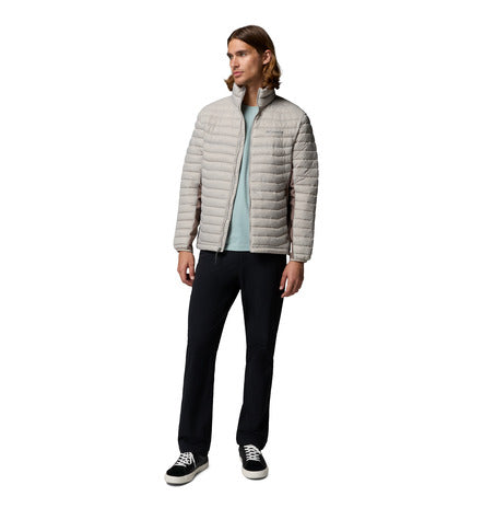Person wearing a gray puffer jacket on a white background