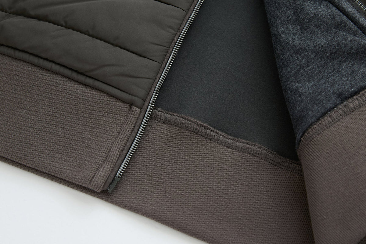 Inside hem of the 6th Sense Air Peat Gilet showing dark lining, overlock stitching and ribbed peat band.