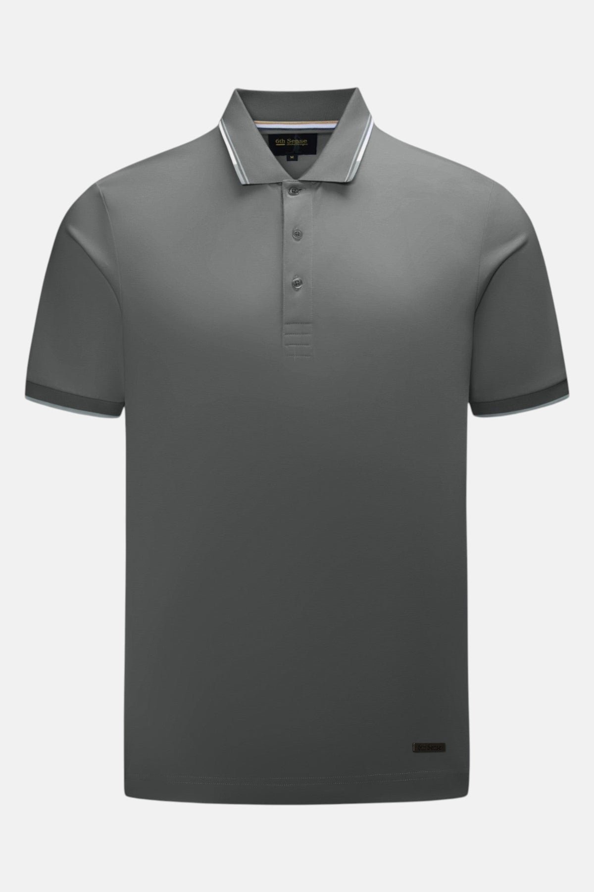 6th Sense Astound December Polo in December, front view. Short-sleeve polo with a three-button placket, ribbed collar and cuffs with white tipping, a 6th Sense label at the inner neck, and a small brand tag at the lower right hem.