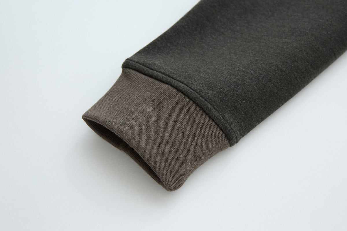 6th Sense Cloud Hybrid Full Zip Peat Jacket sleeve cuff detail showing the ribbed peat-colored knit.