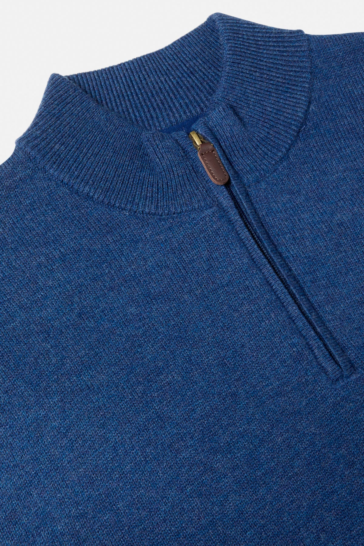 Close-up of a Benetti Franco INDIGO 1/4 zip knit with ribbed collar and leather zip pull.