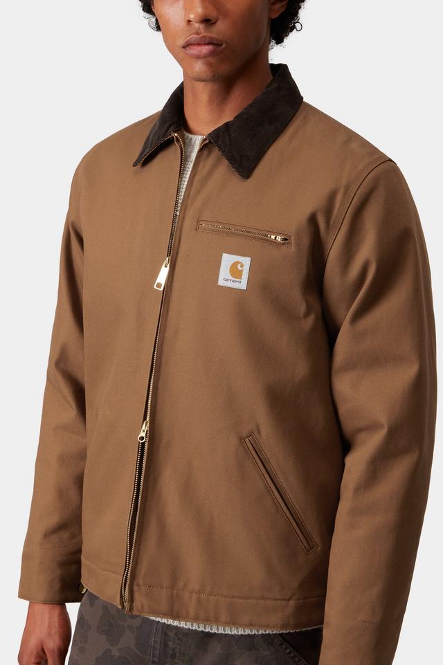 Brown jacket with a visible brand logo on a white background