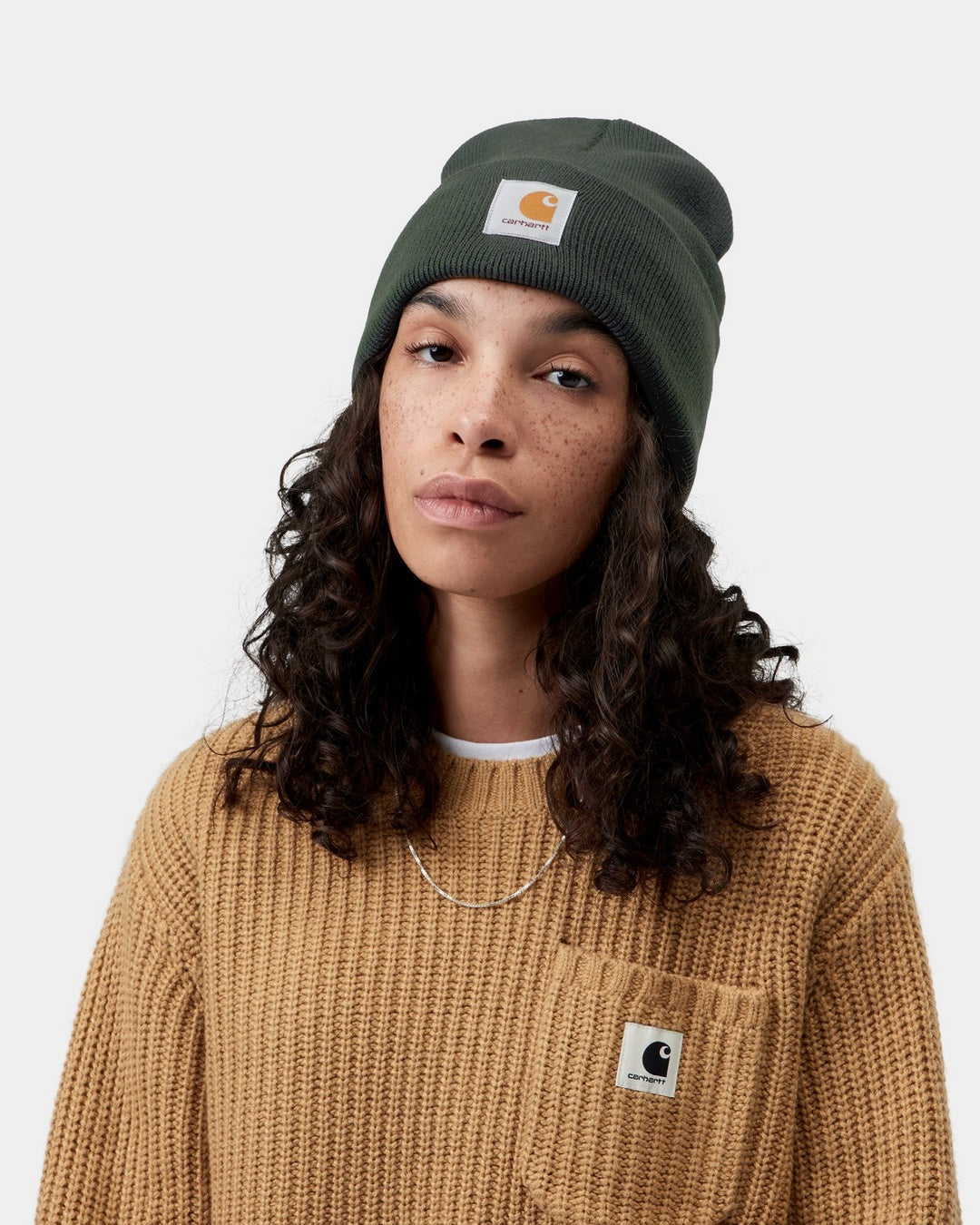 Carhartt WIP Acrylic Watch Hat in Raven, worn on head with front logo patch visible.