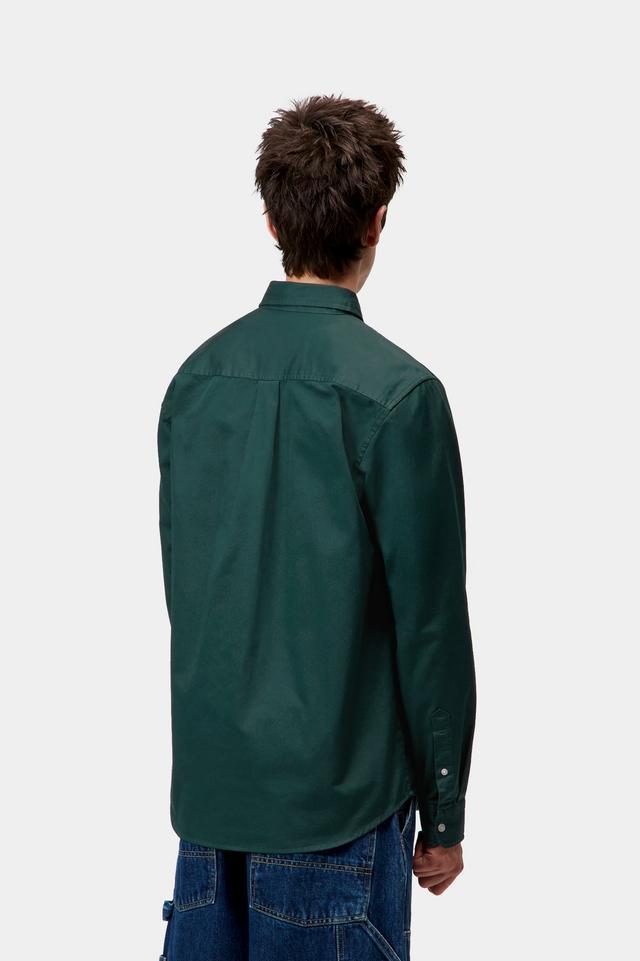 Person wearing a green shirt from behind on a white background