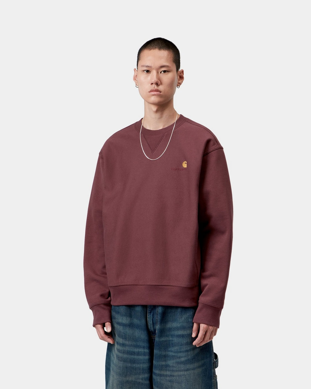 Carhartt WIP American Script Sweatshirt in Amarone, shown on a model from the front with small chest logo embroidery.