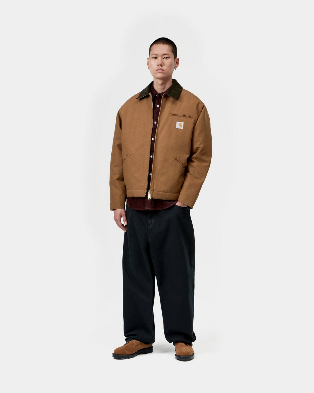 Carhartt WIP OG Detroit Jacket in WIP H Brown / Tobacco, front view on model with corduroy collar and zip front.