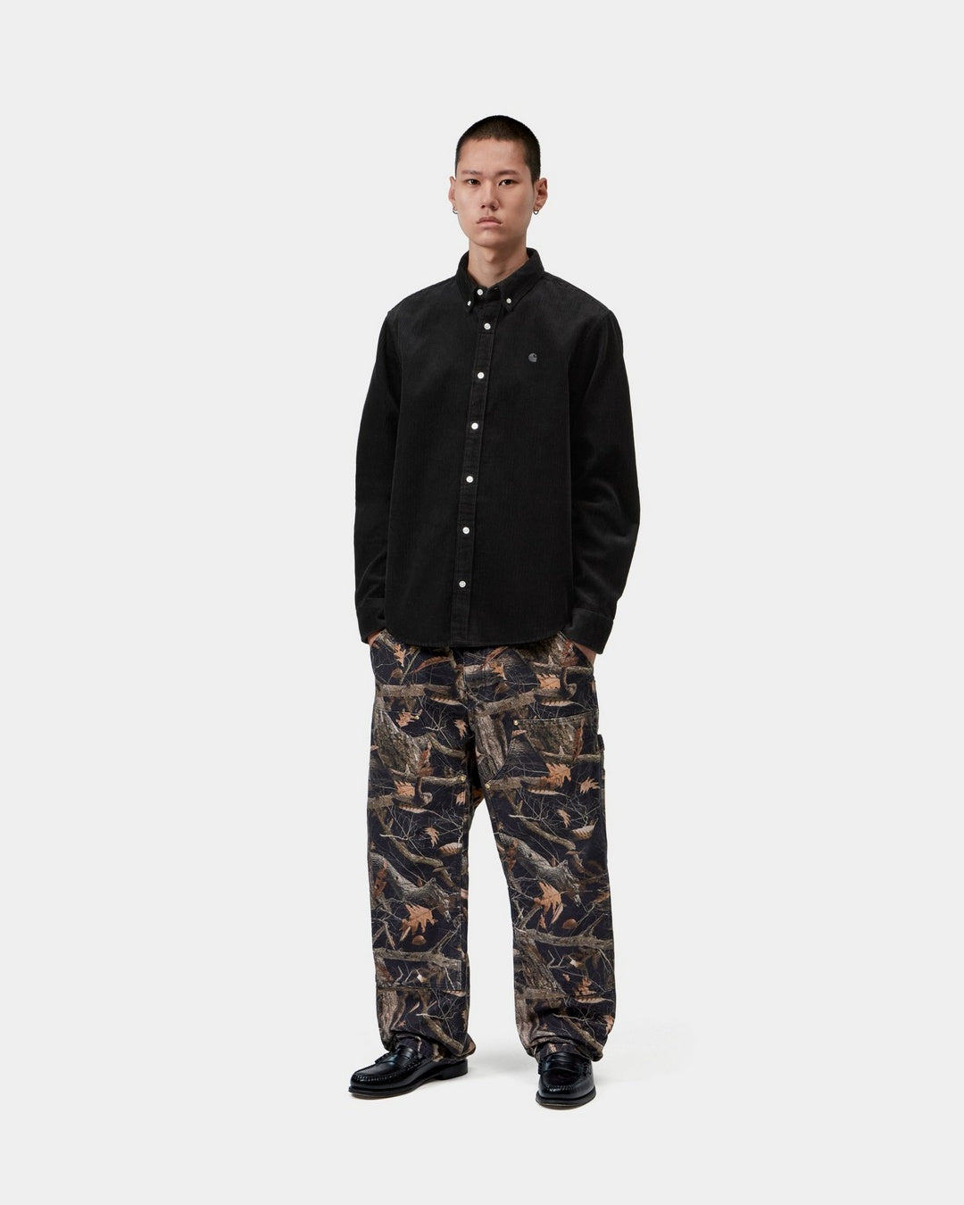 Carhartt WIP L/S Madison Cord Shirt in Soot, worn by model in a front view