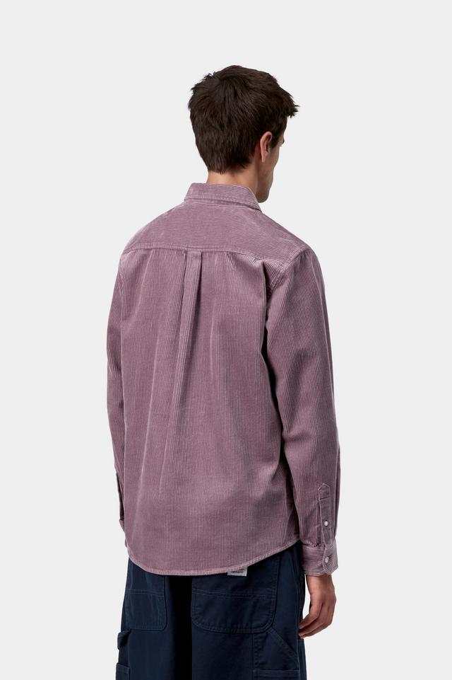 Person wearing a purple shirt on a white background from behind